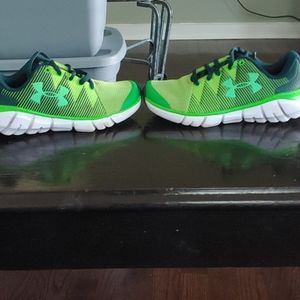 It's a green under Harmour shoes for kids